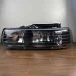Headlight For 1999-2002 Chevy Silverado Suburban Tahoe Black. Fixed Price $74.99.