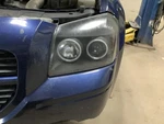 Driver Left Headlight Dark Background Fits 05-07 Magnum 348004. Fixed Price $98.59.